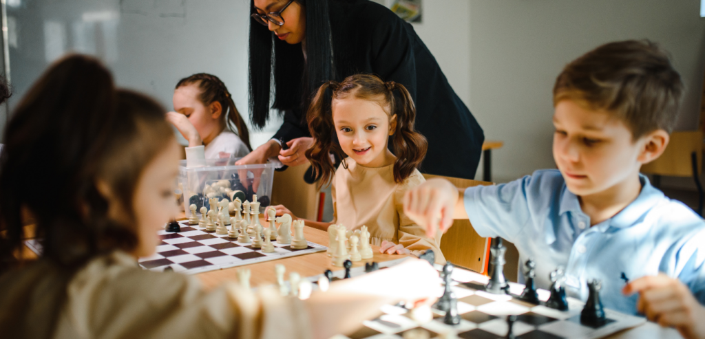 Students playing chess in school club